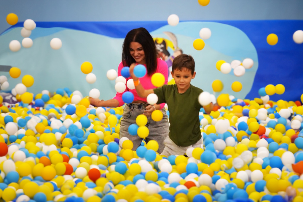 Playing and sharing games in the playground with your kids helps family bonding