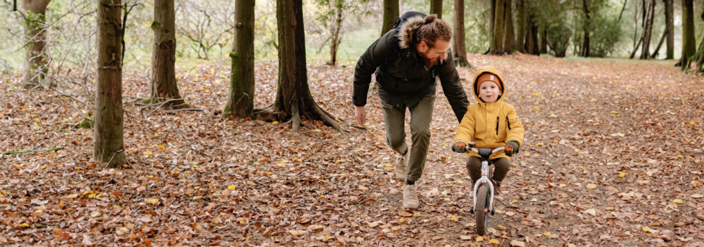 Helping kids build trust by helping them with their challenges, like riding a bicycle 